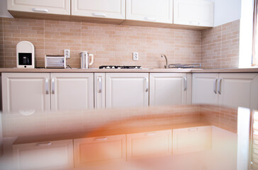 Cozy bright kitchen interior with wooden furniture