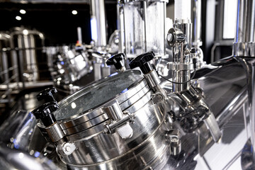 Fototapeta na wymiar Craft beer brewing equipment in privat brewery
