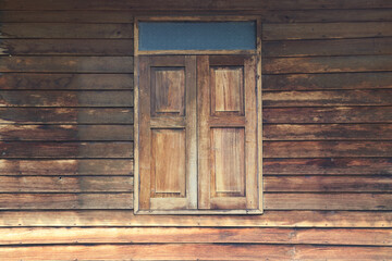 Old wooden window shutters of an thailand house, vintage background.