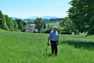 person walking in a meadow