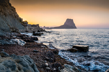 Calpe at sunrise on the Mediterranean coast of Alicante, Spain with views of the Ifach Rock