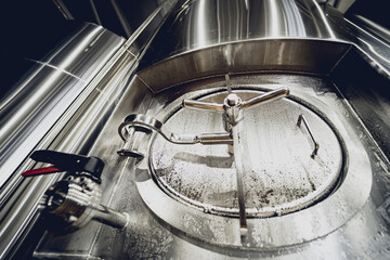 Rows of steel tanks for beer fermentation and maturation in a craft brewery