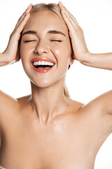 Skin care and make up. Vertical shot of happy laughing woman, touching head, smiling with white...