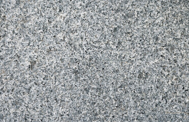 Close-up dark grey terrazzo pattern texture background.