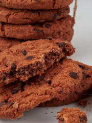Homemade oatmeal cookies folded in a pile on the old table
