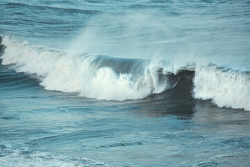 waves crashing on rocks