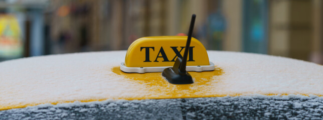 Photography of city taxi in the snowy autumn morning in Moscow. Image with defocused background. Suitable for posters, greeting card. Concept of the coming winter