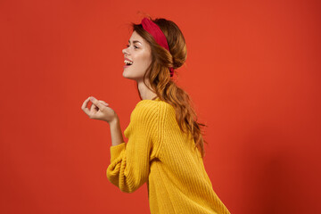 cheerful woman in yellow sweater red headband decoration fashion street style