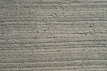 Painted concrete with lines and holes close