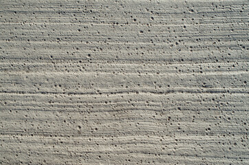 Painted concrete with lines and holes close