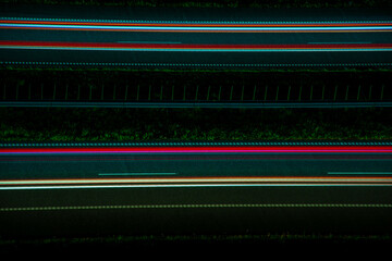 Night road lights. Lights of moving cars at night. long exposure multicolored