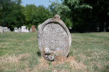 ancient old Tombstones in the cementery of Balatonudvari Hungary. The tompstones are heart shape....
