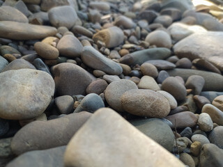 abstract background with round pebble stones. Vacation holiday recreation on beach. 