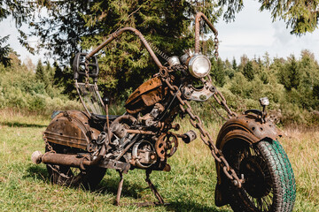An old, rusty motorcycle, with bullet holes in it, post apocalyptic concept
