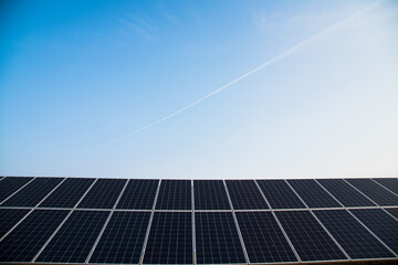 Blue solar panels with the sunny sky