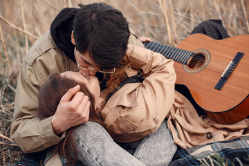Fototapeta premium Beautiful couple spend time in a autumn field