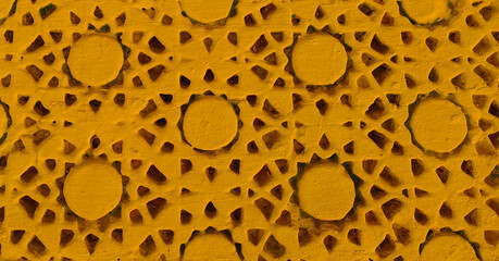 Yellow painted texture of handcrafted details.