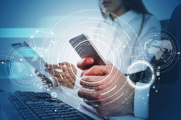 Businessman and businesswoman are holding smartphone and tablet