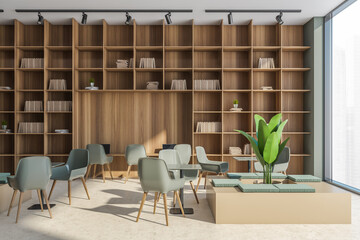 Panoramic office area in beige and green with shelving and seating