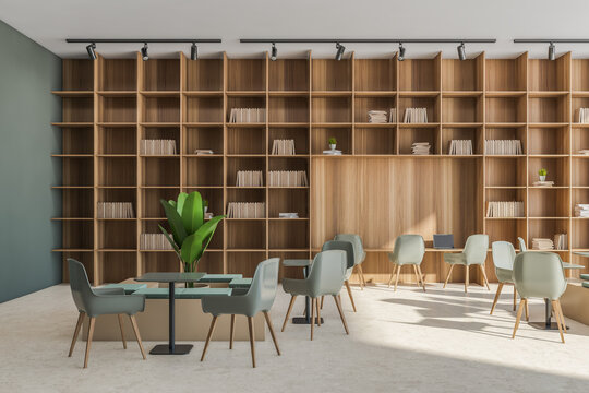 Office service area with beige and green details and large shelving