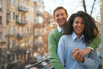 Obraz premium mixed race heterosexual couple loves hugging. Happy together romantic moments