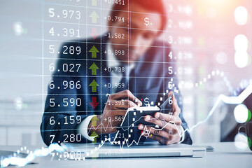 African American businessman wearing formal suit is taking notes