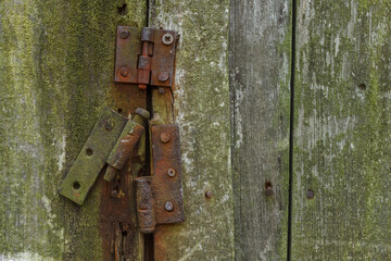 Rusty hinges on rotten doors. Background