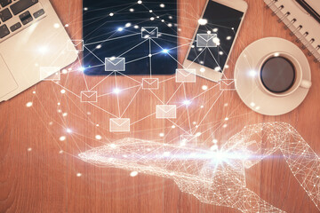 Multi exposure of envelop technology theme drawing over table with phone. Top view. Concept of...