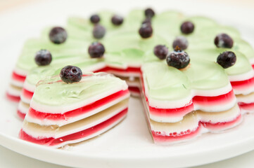 Jelly cake with blueberries. Striped and sweet dessert.