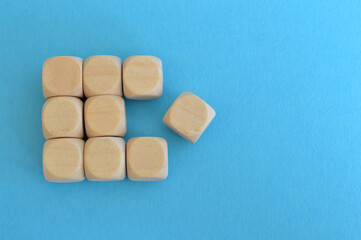 Wooden cube blocks isolated on a blue background