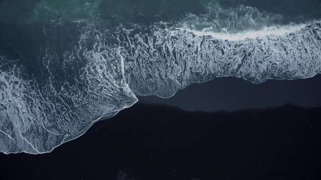 Top view of a black volcanic beach. Drone shot, above black sand beach in Iceland. Aerial view beach black coast coastlinedrone  landscape nobody ocean
