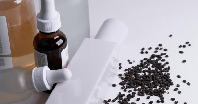 Skincare products with bakuchiol seeds on white background. 