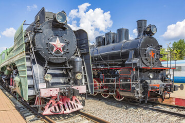 Obraz premium Rare black retro steam locomotive. Exposition area of RZD railway vehicles at Rizhskaya station Moscow, Russia