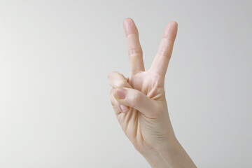Woman showing two fingers gesture