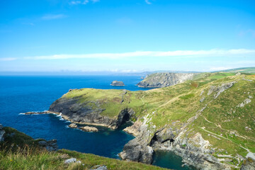 Fototapeta na wymiar Beautiful landscape on the cost of Cornwall. Family vacations in England on the ocean.