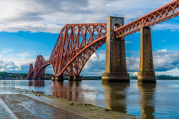 A view from a slipway in Queensferry of the Forth Railway bridge over the Firth of Forth, Scotland...