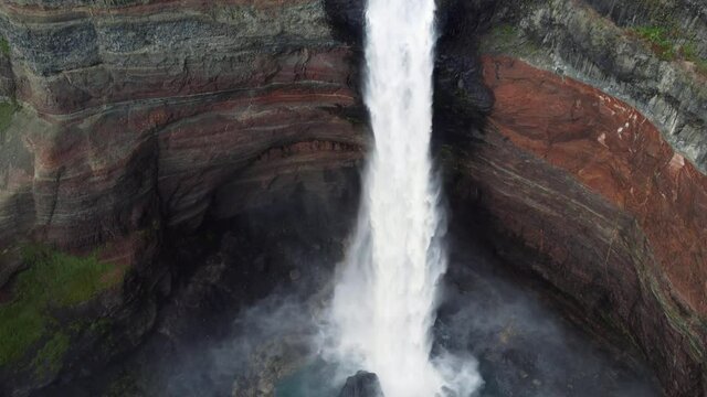 Hengifoss waterfall in iceland. Aerial drone video of Icelandic landscape. Famous tourist attractions and landmarks destinations in Icelandic nature on Iceland. 4K UHD video.

