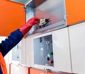 The engineer checks the absence of induced voltage on the high voltage cells