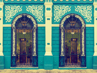 Colonial building facade in Camaguey, Cuba. Toned image. 