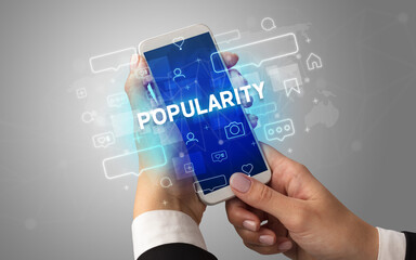 Hand using smartphone with social media concept