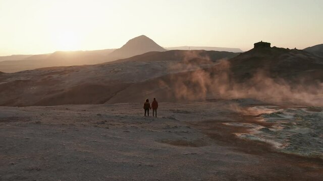 Couple Intimately Strolling on a Geothermal Area in Iceland