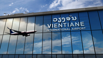 Obraz premium Airplane landing at Vientiane Laos airport mirrored in terminal