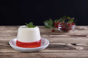 italian dessert panna cotta with red currant jelly
