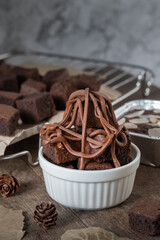 close up Chocolate brownie cake, dessert with milk on a dark background on a wooden table.