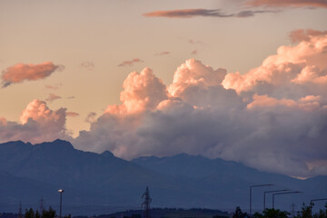 Beautiful scene of puffy clouds in the sky at the sunset