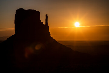 Sunrise over the buttes of Monument Valley (also known at "The Mittens") on the border of Utah and Arizona.