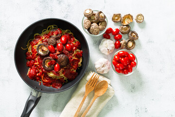 Spaghetti with meatballs, tomato sauce. Background. Italian American dish. Meatballs pasta in a pan. Space for text. Overhead. Traditional Italian cuisine. Dark rustic wooden table. Dinner with pasta