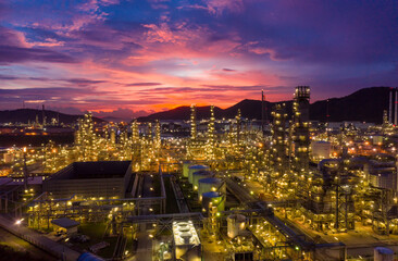 Aerial view Oil refinery. Industrial view at oil refinery plant form industry zone with sunrise and cloudy sky.