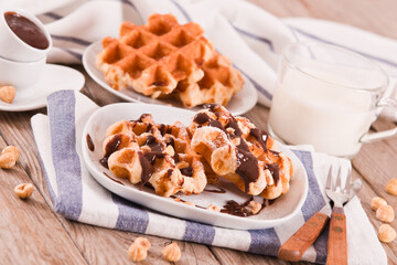 Waffles with chocolate cream and hazelnuts.