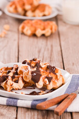 Waffles with chocolate cream and hazelnuts.